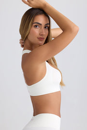 Super Sculpt Seamless T-Back Sports Bra in Eggshell